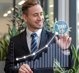 Professional business team analyzing growth charts and sales data on modern computer displays